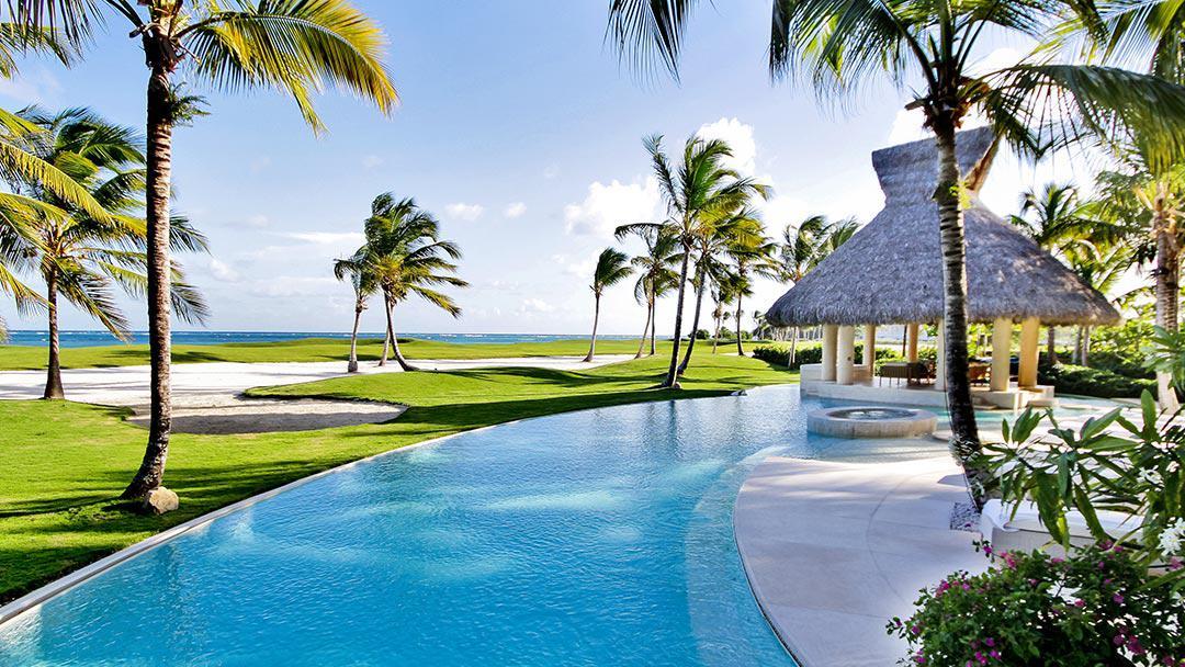 A Caribbean luxury villa next to a golf course